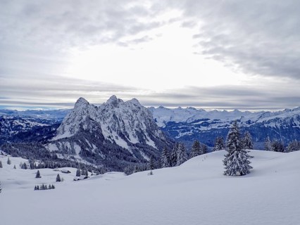 Beautiful winter landscape in central Switzerland. View towards the central Alps with the peaks of