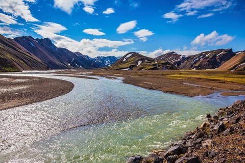 The picturesque valley in the national park Landmannalaugar, Iceland. Summer flood of meltwater