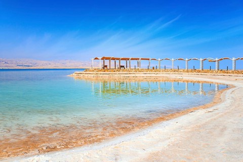 The drainless salt lake in the Middle East. Dead Sea. Israel. Evaporated salt forms ?rystals on the