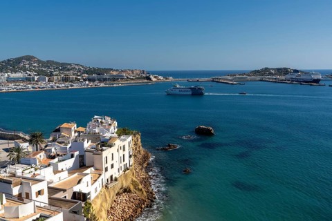 Ibiza, Spain, 1 February, 2024: view of Eivissa town and harbour with a ferry arriving in port