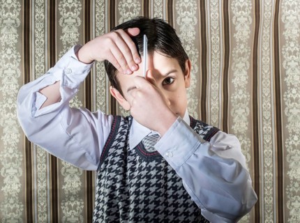 Child vintage clothes decided his hair. Close up shot