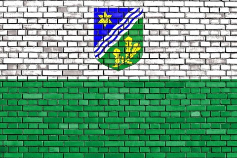 Flag of Tartu County painted on brick wall