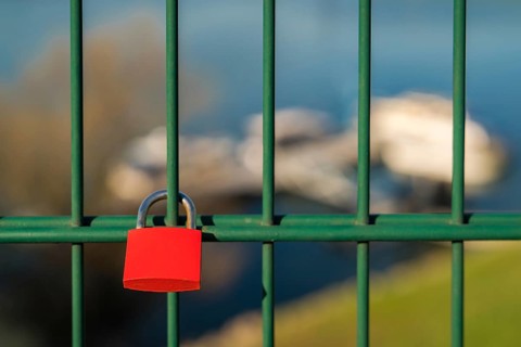 Love lock and grid of the lift bridge Walsum in Duisburg, North Rhine-Westphalia, Germany, with