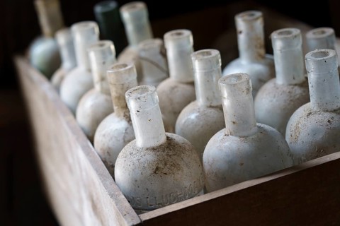 Old empty bottles, essences for alcoholic beverages, old Ripoll winery, Llucmajor, Majorca,