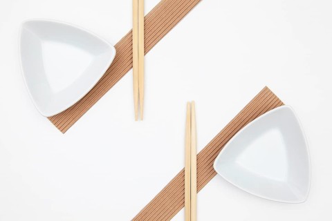Top View Of White Empty Sushi Plates With Bamboo Chopsticks. Symmetry Food Design