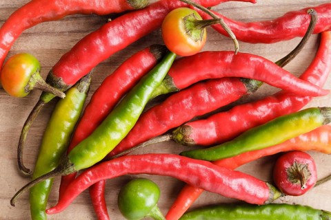 Red hot chilli pepper on milled paprika