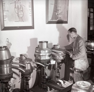 History of milk and cream making machinery. A man in a museum of separators. Machines made for the