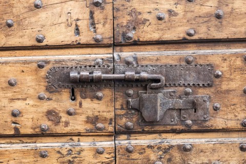 Close up of rustic old door in Spoleto, Italy