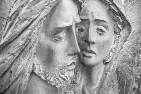 Bas-relief in bronze representing The Pity of Michelangelo. Faces of Holy Mary mother and Jesus