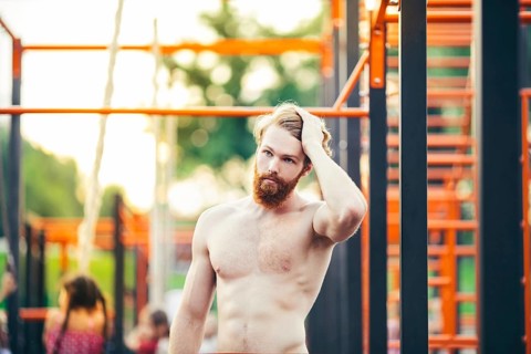 Subject sport street workout Handsome young caucasian man with a bare-chested muscular with long