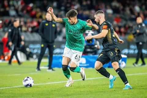 MELBOURNE, AUSTRALIA, MAY 24: Ben Parkinson of Newcastle United competes with Benjamin Garuccio of