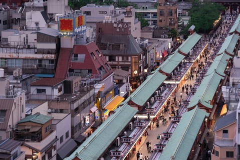 Tourists walk through the Nakamise-dori shopping street of Senso-ji in Asakusa. Senso-ji is the