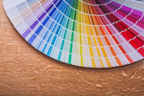 Pantone color palette guide on wooden board construction concept