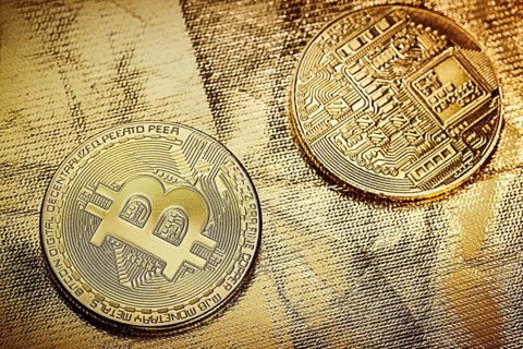 Two bitkoins on gold backgound