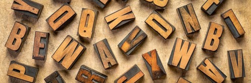 Random letters overhead background - vintage letterpress wood type of different fonts (inverted