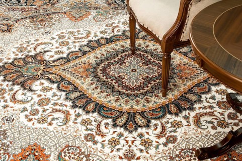 Antique chair and table on the decorated oriental carpet