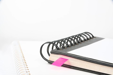 Blank Opened Spiral Notebook Placed On A Table Showing New Ideas