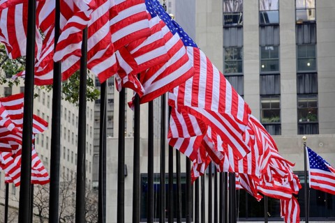 Rockefeller Center, Manhattan, New York, USA, North America, Many American flags fly in front of a