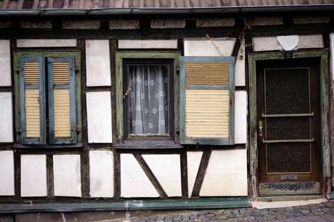An old rickety half-timbered house with a striking beam construction