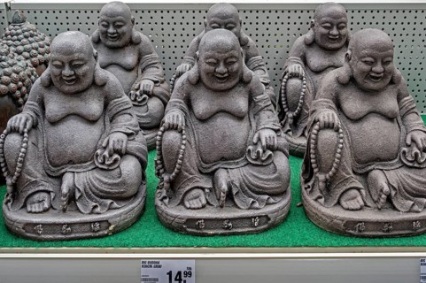 Decorative material, Sitting grey Buddha figures in a DIY store, Allgäu, Swabia, Bavaria, Germany