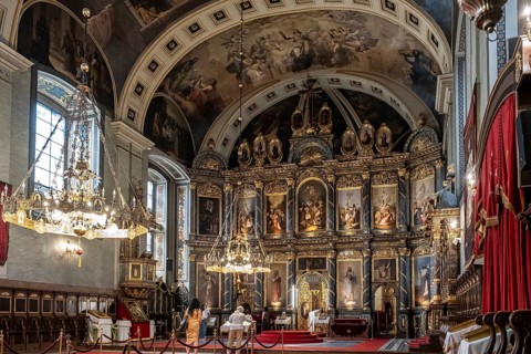 Magnificent interior view of orthodox cathedral with iconostasis and chandeliers