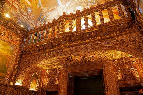 Carvings decorated with gold leaf above the altar of the Church of St Anto, Igreja de Santo