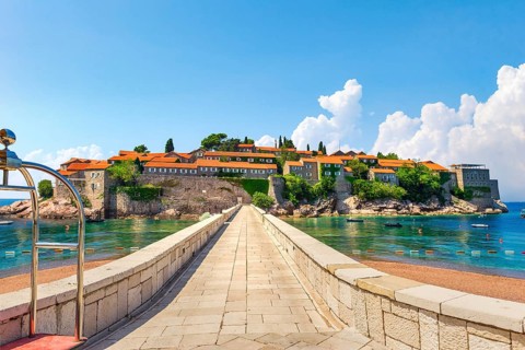 Road to Sveti Stefan, peninsula with ancient architecture in Adriatic sea