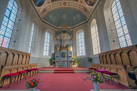 Main altar with choir stalls, St. Blasius Catholic Parish Church in Dietmannsried, Allgäu, Bavaria,