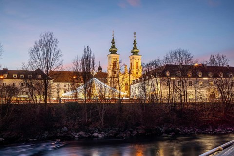 Illuminated Mariahilferkirche, river Mur, blue hour, Graz, Styria, Austria