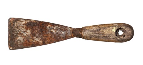 An old rusty and dirty putty knife isolated