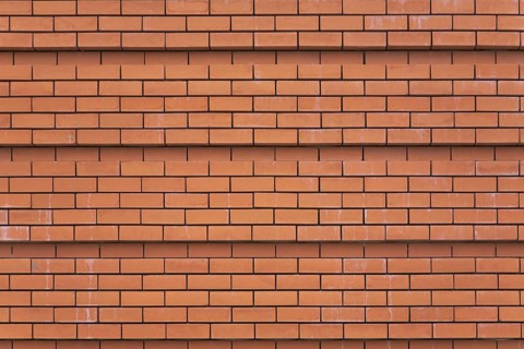 Wall of a cathedral ideally laid out by red bricks in Madrid