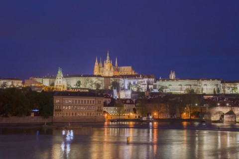 Vltava river with famous Hradcany castle and St. Vitus Cathedral in Prague, Czech Republic, by