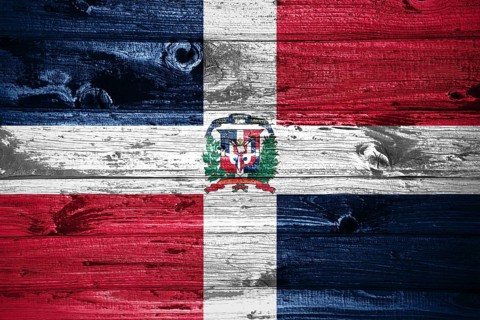 Dominican Republic flag on wooden planks background wood flag
