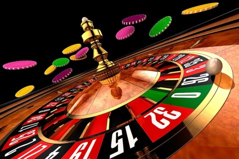 Roulette in casino chips from flying, wide shot on a black background