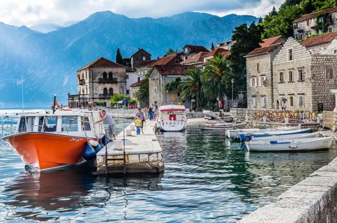 PERAST, MONTENEGRO, JUNE 18: View on embankment and boats in old town on June 18, 2014 in Perast,