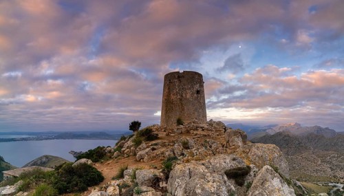 A view of the Albercutx watchtower at Cap de Formentor in northwestern Mallorca at sunrise