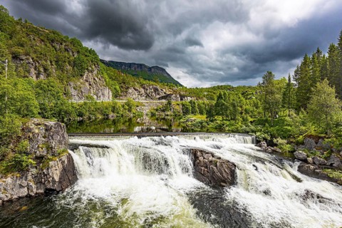 Magnificent seething waterfall - the threshold on the river Bioreio. The interesting trip to the