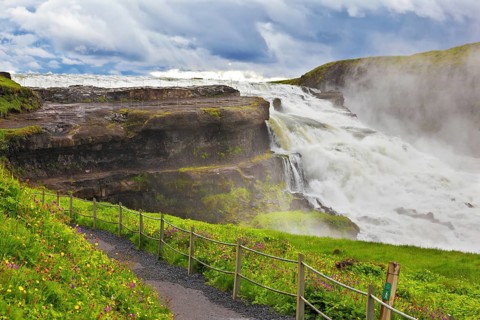 Powerful high-water waterfall in Iceland. For walks and observations on the hillside laid