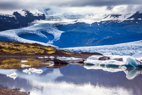 The grand glacier Vatnajokull is melting at the edges, sliding to the ocean. Glacier meltwater form