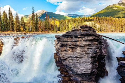 Magnificent rock divides thundering Athabasca Falls. Athabasca Falls is the most powerful waterfall