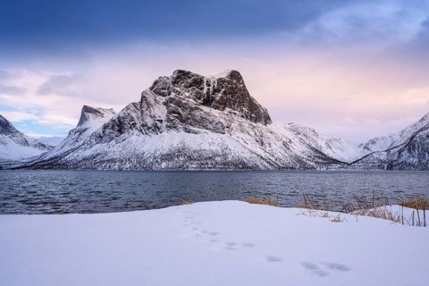 Beautiful winter landscape scene, sunset or sunrise in mountains and fjords