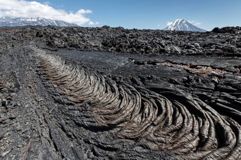 Volcanic landscape of Kamchatka Peninsula: beautiful view of lava field volcanic eruption active