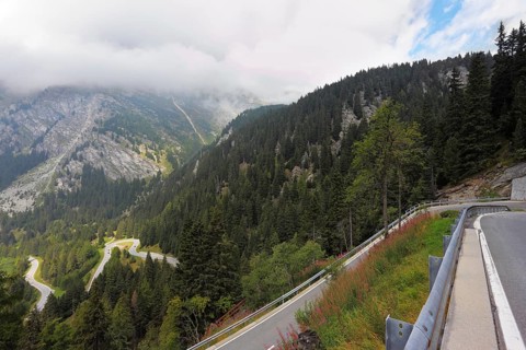 Italy, Dolomites. The magnificent mountain valley. Winding and dangerous road - the Serpentine.