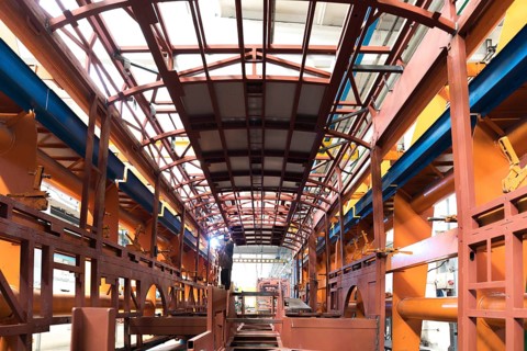 One working day of modern automatic bus trolleybus car production with unfinished cars workers in