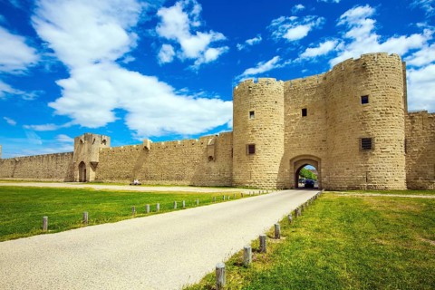 The picturesque powerful gates and fully preserved antique city walls surround the port city of