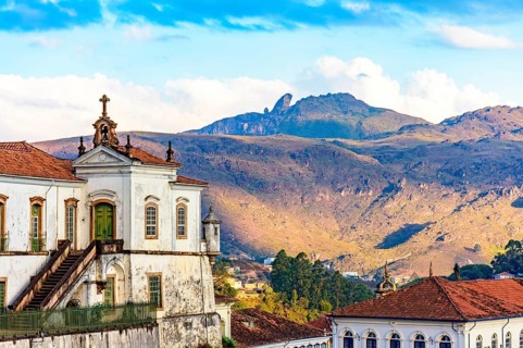 Baroque church and mountains in the city of Ouro Preto in Minas Gerais with the mountains and peak