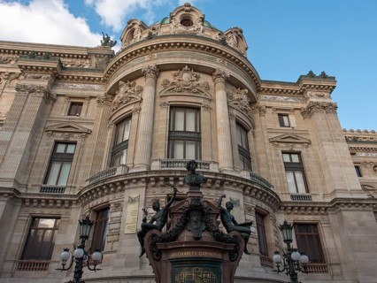 Fascinating front view of a magnificent opera house with richly decorated façade elements and