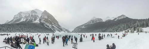 Lake Louise, Alberta, Canada. Jan 29, 2024. A panoramic scene capturing individuals engaged in ice