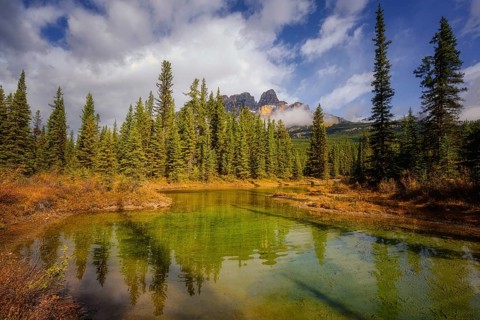Beautiful autumn landscape scene in lake and mountain in background in west Canada