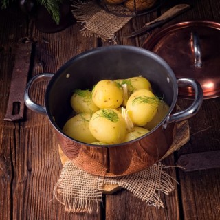 Fresh boiled young potatoes with butter